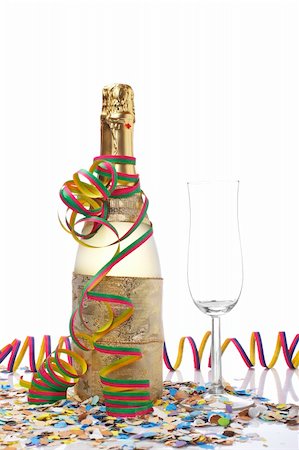 simsearch:400-05082002,k - Champagne bottle with empty glass, ribbons and confetti for celebrations Photographie de stock - Aubaine LD & Abonnement, Code: 400-04547857