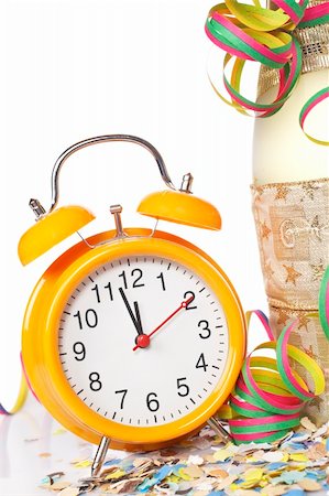 simsearch:400-05082002,k - Waiting the New Year with champagne bottle and clock. Shallow depth of field Photographie de stock - Aubaine LD & Abonnement, Code: 400-04547858