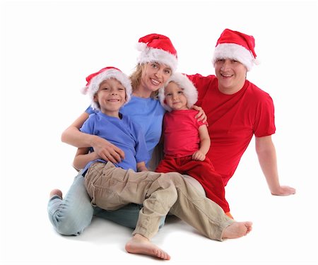 father christmas family portrait - Happy family in Christmas hats Photographie de stock - Aubaine LD & Abonnement, Code: 400-04548459