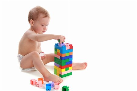 simsearch:400-04161270,k - Child builds the house of the cubes Foto de stock - Super Valor sin royalties y Suscripción, Código: 400-04548463