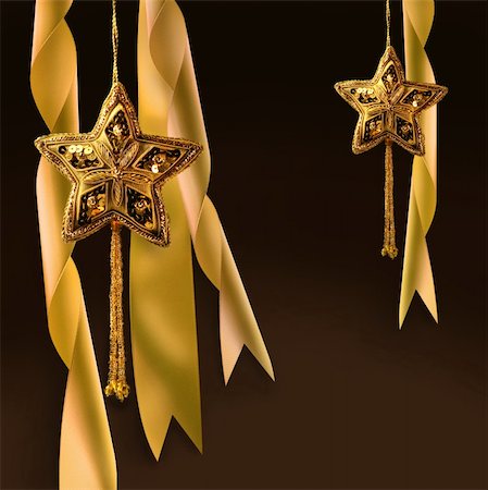simsearch:400-04073863,k - Gold christmas star with ribbons against dark background Photographie de stock - Aubaine LD & Abonnement, Code: 400-04548656