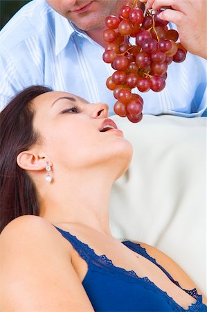 photo of model woman with grapes - Close up portrait of nice young brunette getting tempted with grape Stock Photo - Budget Royalty-Free & Subscription, Code: 400-04548972