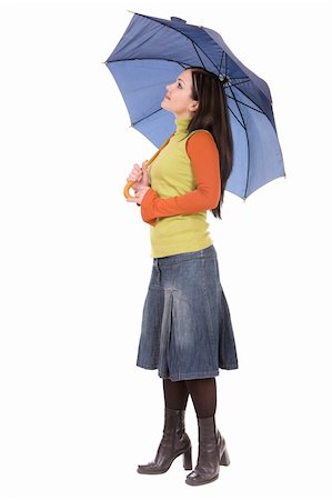attractive brunette woman with umbrella over white background Photographie de stock - Aubaine LD & Abonnement, Code: 400-04549041