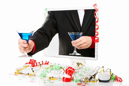 A hand offering a glass of blue martini while the other holding for himself. Confetti scattered around the computer. Stock Photo - Budget Royalty-Free & Subscription, Code: 400-04549090