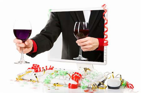 A man is offering a glass of wine from inside the computer's screen. Confetti scattered arroung the computer. Stock Photo - Budget Royalty-Free & Subscription, Code: 400-04549092