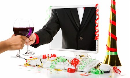 Toat between two person with wine, one from inside computer's screen. Confetti scattered around the computer. Stock Photo - Budget Royalty-Free & Subscription, Code: 400-04549093