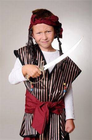 rogues - Boy Pirate isolated on gray with a cutlass Stockbilder - Microstock & Abonnement, Bildnummer: 400-04540008