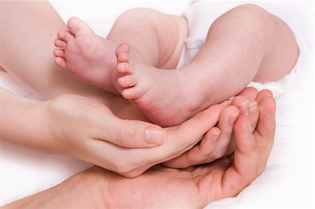 Little baby foots in hands of parents. Family concept Stock Photo - Budget Royalty-Free & Subscription, Code: 400-04540031