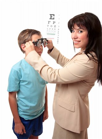 Smiling female optometrist stands with a child patient. Stockbilder - Microstock & Abonnement, Bildnummer: 400-04540051