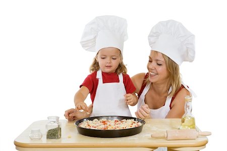 family cheese - Woman and little girl preparing a pizza - isolated Stock Photo - Budget Royalty-Free & Subscription, Code: 400-04540218