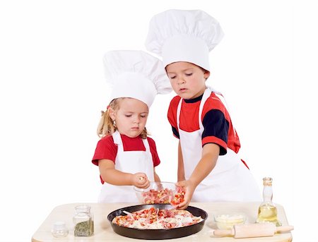 family cheese - Two kids dressed as chefs preparing a pizza - isolated Stock Photo - Budget Royalty-Free & Subscription, Code: 400-04540280