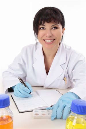 simsearch:400-04962353,k - Scientist at desk with research notes, spotting plate and laboratory chemicals. Stock Photo - Budget Royalty-Free & Subscription, Code: 400-04540626