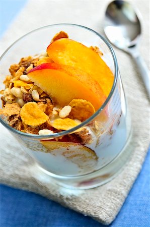 peach slice - Serving of yogurt with fresh peaches and granola Stock Photo - Budget Royalty-Free & Subscription, Code: 400-04540807