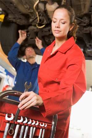 simsearch:400-05735179,k - Two mechanics working under car Stockbilder - Microstock & Abonnement, Bildnummer: 400-04540980