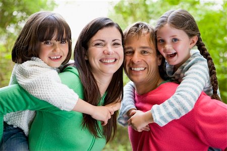 simsearch:400-05686748,k - Family outdoors smiling Fotografie stock - Microstock e Abbonamento, Codice: 400-04541056