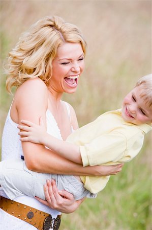 simsearch:400-04043055,k - Mother holding son outdoors smiling Stock Photo - Budget Royalty-Free & Subscription, Code: 400-04541070
