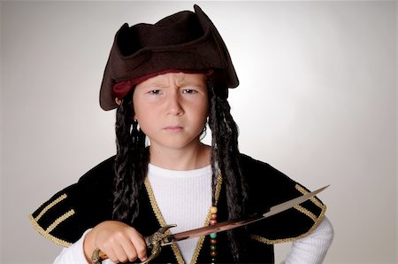 rogues - Boy Pirate isolated on black with a cutlass Stockbilder - Microstock & Abonnement, Bildnummer: 400-04541253