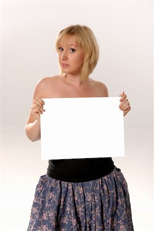 simsearch:400-04364119,k - attractive blond woman holding blank card Fotografie stock - Microstock e Abbonamento, Codice: 400-04541287