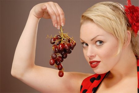 photo of model woman with grapes - pretty girl holding red grapes to tempt you Stock Photo - Budget Royalty-Free & Subscription, Code: 400-04541606