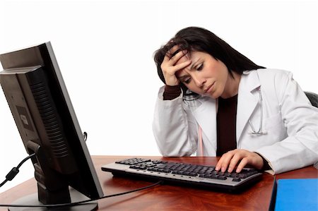 simsearch:400-05748649,k - Overworked tired or stressed doctor sitting at computer. Foto de stock - Super Valor sin royalties y Suscripción, Código: 400-04541929