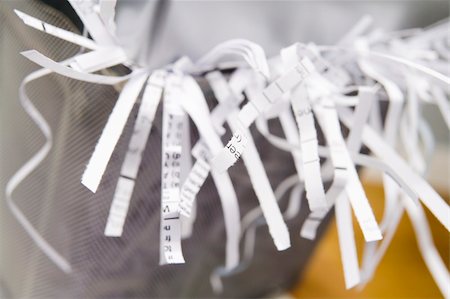 shredded document - Close-Up Of An Overflowing Paper Shredder Stock Photo - Budget Royalty-Free & Subscription, Code: 400-04542051