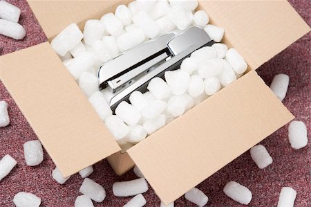 packing peanuts - A Package Containing A Stapler Stock Photo - Budget Royalty-Free & Subscription, Code: 400-04542052