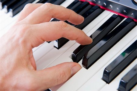 piano practice - Close-up of hands playing the piano. Stock Photo - Budget Royalty-Free & Subscription, Code: 400-04542350