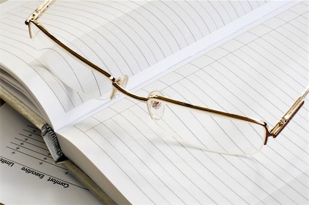 simsearch:400-04592928,k - gold glass and white blank notebook. daylight. Stock Photo - Budget Royalty-Free & Subscription, Code: 400-04542876