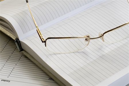 simsearch:400-04592928,k - gold glass and white blank notebook. daylight. Stock Photo - Budget Royalty-Free & Subscription, Code: 400-04542877