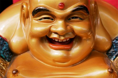 Head and Chest of golden smiling Buddha Statue from Japan Stock Photo - Budget Royalty-Free & Subscription, Code: 400-04542988