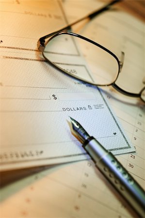 Vertical image of money check and glasses Stock Photo - Budget Royalty-Free & Subscription, Code: 400-04543283