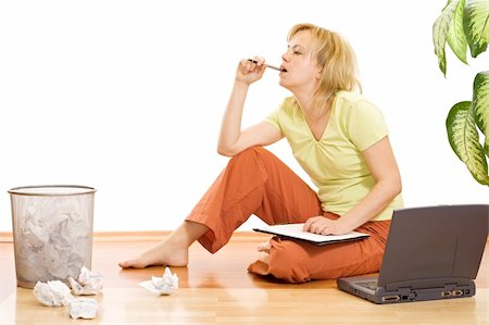 sleepy girl is sad - Tired woman working sitting on the floor and thinking - isolated Stock Photo - Budget Royalty-Free & Subscription, Code: 400-04543305