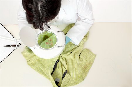 stain on shirt - A forensic investigator observes and obtains samples from a shirt for further analysis. Stock Photo - Budget Royalty-Free & Subscription, Code: 400-04543376