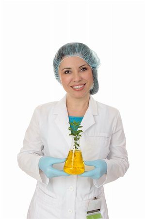 Smiling female scientist holding a small leafy plant.  Plant biology is the  scientific study of plant life and development and includes growth, diseases and reproduction. Foto de stock - Super Valor sin royalties y Suscripción, Código: 400-04543608