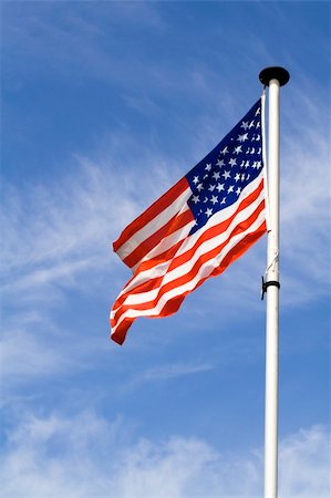 simsearch:400-05136582,k - Waving american flag against blue sky background Stockbilder - Microstock & Abonnement, Bildnummer: 400-04543758