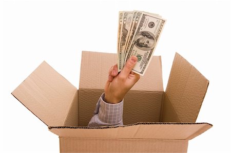 simsearch:400-04717440,k - Hand with dollars inside a cardboard box Stock Photo - Budget Royalty-Free & Subscription, Code: 400-04554020