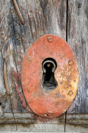 A rusty keyhole on an old wooden door in Spain. Stock Photo - Budget Royalty-Free & Subscription, Code: 400-04554108