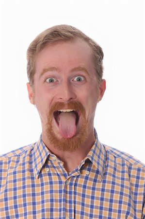 sticking out her tongue - Portrait of man showing his tongue Stock Photo - Budget Royalty-Free & Subscription, Code: 400-04554214