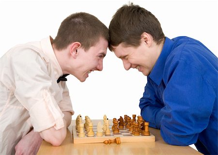 Boys play chess on a white background Stock Photo - Budget Royalty-Free & Subscription, Code: 400-04554393