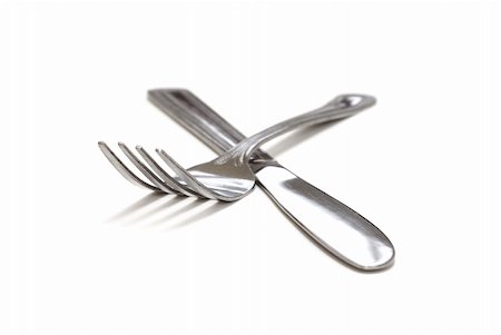 simsearch:700-05642632,k - A macro shot of an isolated knife and fork. Fotografie stock - Microstock e Abbonamento, Codice: 400-04554591