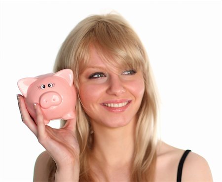 Woman saving money in a piggy bank Stock Photo - Budget Royalty-Free & Subscription, Code: 400-04554974