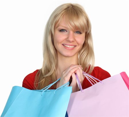 simsearch:400-04377587,k - Femme avec des sacs à provisions souriant à la caméra Photographie de stock - Aubaine LD & Abonnement, Code: 400-04554979