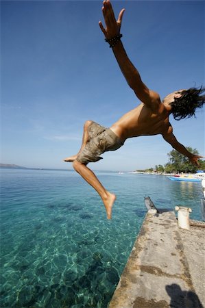 salto - a surfer making a backflip in indonesia Stockbilder - Microstock & Abonnement, Bildnummer: 400-04555011