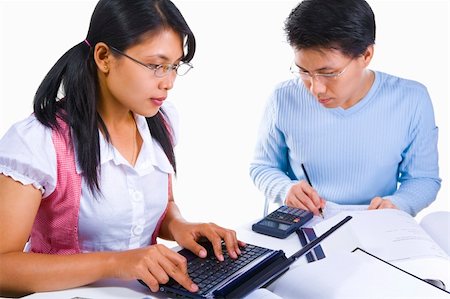 Two Asian scholars is busy studying and finish an assignment Stock Photo - Budget Royalty-Free & Subscription, Code: 400-04555113