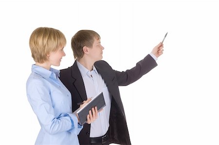 simsearch:400-05694035,k - Portrait of businessman pointing at wall with woman near by. Isolated over white. Stock Photo - Budget Royalty-Free & Subscription, Code: 400-04555536
