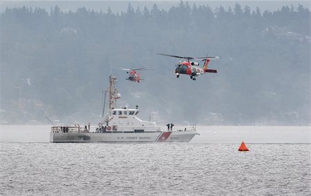 disaster and rescue - Coast guard performing it's rescue demonstration. Stock Photo - Budget Royalty-Free & Subscription, Code: 400-04555638