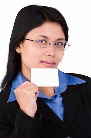 A you woman in suit show her name card. Shoot agaist very bright white background that naturally seperete her from it. Foto de stock - Super Valor sin royalties y Suscripción, Código: 400-04555740