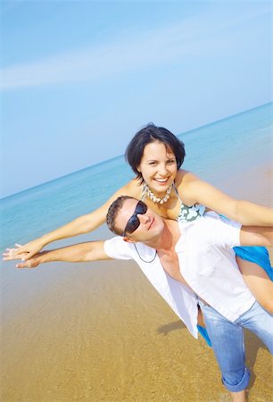 simsearch:400-05227851,k - a portrait of attractive couple having fun on the beach Fotografie stock - Microstock e Abbonamento, Codice: 400-04556182