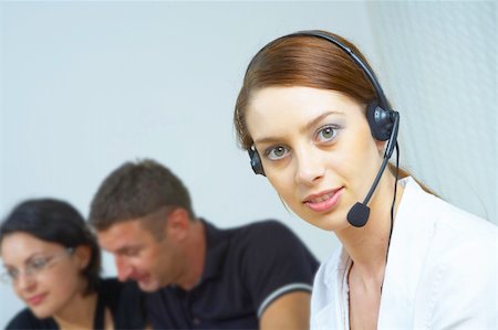 simsearch:400-04167141,k - portrait of a friendly secretary/telephone operator in an office environment. Foto de stock - Super Valor sin royalties y Suscripción, Código: 400-04556192