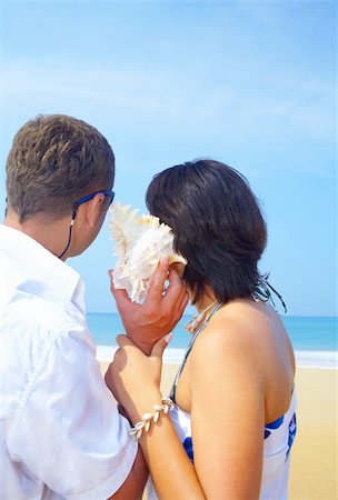 a portrait of attractive couple having fun on the beach Stock Photo - Budget Royalty-Free & Subscription, Code: 400-04556209